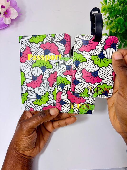 A person's hands holding a colorful passport holder with a floral pattern.