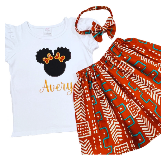 Girls' African print fabric skirt set with a personalized embroidered t-shirt and a matching headband