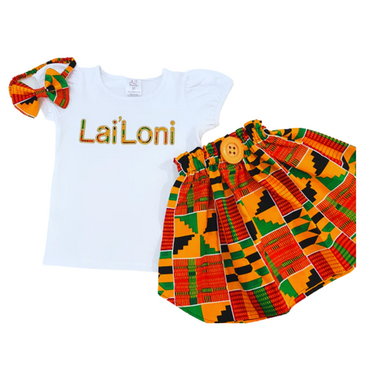 Girls' vibrant kente fabric skirt set with a personalized embroidered t-shirt and a matching headband